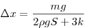 \Delta x = \frac{mg}{2 \rho g S + 3k} 